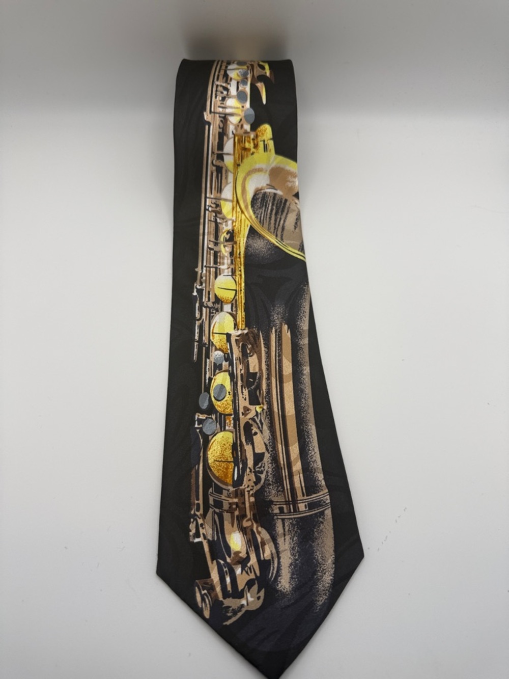 Steven Harris novelty tie featuring saxophone design in Black,Tan & Gold